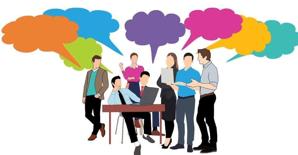 Zakelijke illustratie van collega’s in overleg met verschillende meningen – symbool voor het belang van constructieve feedback binnen een team.